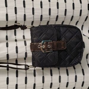 Avon classic quilted crossbody black with brown lining. Buckle front NWT…